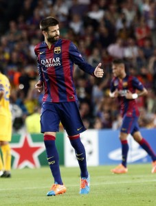 451637-barcelonas-gerard-pique-l-celebrates-a-goal-next-to-neymar-against-apo
