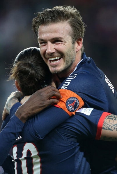 PARIS, FRANCE - MAY 18: David Beckham of PSG jumps on Zlatan Ibrahimovic after Zlatan scores a goal during the Ligue 1 match between Paris Saint-Germain FC and Stade Brestois 29 at the Parc des Princes stadium on May 18, 2013 in Paris, France. (Photo by John Berry/Getty Images)