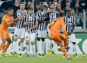 TURIN, ITALY - NOVEMBER 05: Cristiano Ronaldo of Real Madrid tries to shoot a frre kick over the Juventus wall during the UEFA Champions League Group B match between Juventus and Real Madrid at Juventus Arena on November 5, 2013 in Turin, Italy. (Photo by Claudio Villa/Getty Images)