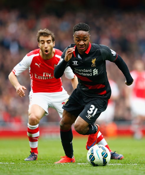 LONDON, ENGLAND - APRIL 04: Raheem Sterling of Liverpool goes past Mathieu Flamini of Arsenal during the Barclays Premier League match between Arsenal and Liverpool at the Emirates Stadium on April 4, 2015 in London, England. (Photo by Julian Finney/Getty Images)