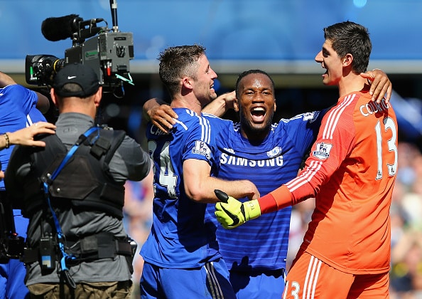 LONDON, ENGLAND - MAY 03: Gary Cahill, Didier Drogba and Thibaut Courtois of Chelsea celebrate winning the Premier League title after the Barclays Premier League match between Chelsea and Crystal Palace at Stamford Bridge on May 3, 2015 in London, England. (Photo by Clive Mason/Getty Images)