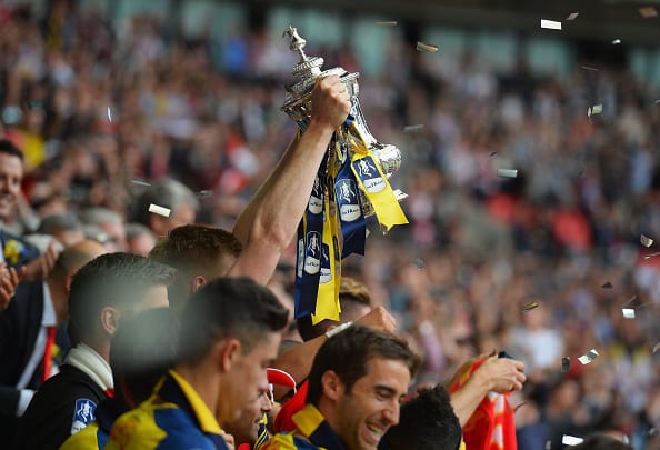 LONDON, ENGLAND - MAY 30: Per Mertesacker of Arsenal lifts the trophy after the FA Cup Final between Aston Villa and Arsenal at Wembley Stadium on May 30, 2015 in London, England. (Photo by Michael Regan - The FA/The FA via Getty Images)