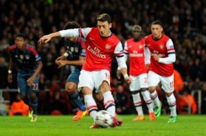 LONDON, ENGLAND - FEBRUARY 19: Mesut Oezil of Arsenal misses from the penalty spot during the UEFA Champions League Round of 16 first leg match between Arsenal and FC Bayern Muenchen at Emirates Stadium on February 19, 2014 in London, England. (Photo by Shaun Botterill/Getty Images)