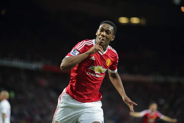 MANCHESTER, ENGLAND - SEPTEMBER 12:  Anthony Martial of Manchester United celebrates after scoring a goal to make it 3-1 on his debut during the Barclays Premier League match between Manchester United and Liverpool on September 12, 2015 in Manchester, United Kingdom.  (Photo by Matthew Ashton - AMA/Getty Images)