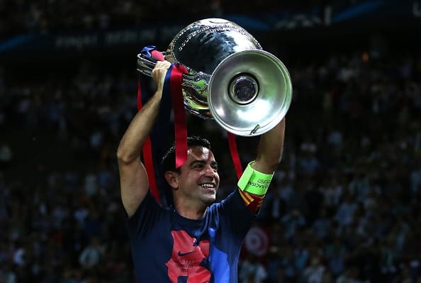 Xavi vandt mange titler i sin tid hos FC Barcelona. Her ses han med Champions League-trofæet efter Barcelonas finalesejr over Juventus i 2015 i München. Foto: Chris Brunskill / Getty Images