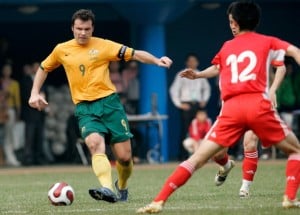 Mar 24, 2007, Guangzhou, China, Cao Yang of China (R) trys to stop the pass of Mark Viduka of Australia during a warm-up football match between China and Australia. Australia won 2:0. (Photo by Osports/Getty Images)