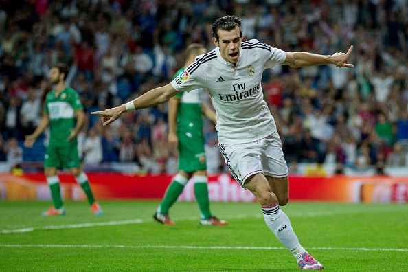 MADRID, SPAIN - SEPTEMBER 23:  Gareth Bale of Real Madrid CF celebrates scoring their opening goal during the La Liga match between Real Madrid CF and Elche CF at Estadio Santiago Bernabeu on September 23, 2014 in Madrid, Spain.  (Photo by Gonzalo Arroyo Moreno/Getty Images)