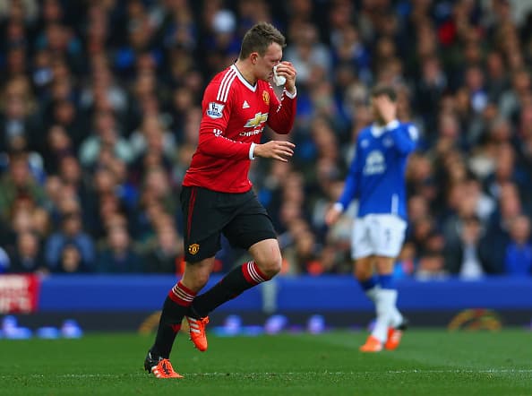 LIVERPOOL, ENGLAND - OCTOBER 17: Phil Jones of Manchester United tries to stop bleeding form his nose during the Barclays Premier League match between Everton and Manchester United at Goodison Park on October 17, 2015 in Liverpool, England. (Photo by Clive Brunskill/Getty Images)