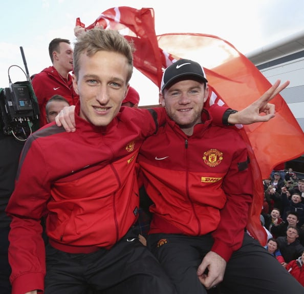 MANCHESTER, ENGLAND - MAY 13: Anders Lindegaard and Wayne Rooney of Manchester United pose on their Barclays Premier League Trophy Parade through Manchester on May 13, 2013 in Manchester, England. (Photo by John Peters/Man Utd via Getty Images)