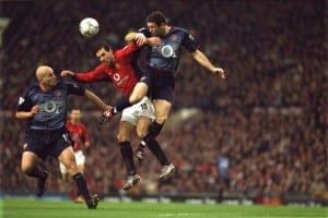 MANCHESTER, ENGLAND - DECEMBER 7: Ruud Van Nistelrooy competes for the ball with Martin Keown and Pascal Cygan during the FA Barclaycard Premiership match between Manchester United v Arsenal at Old Trafford on December 7, 2002 in Manchester, England. (Photo by Tom Purslow/Manchester United via Getty Images)