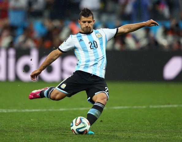 SAO PAULO, BRAZIL - JULY 09: Sergio Aguero of Argentina shoots and scores his penalty kick in a shootout during the 2014 FIFA World Cup Brazil Semi Final match between the Netherlands and Argentina at Arena de Sao Paulo on July 9, 2014 in Sao Paulo, Brazil. (Photo by Ronald Martinez/Getty Images)