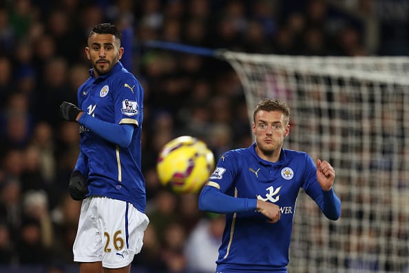 LEICESTER, ENGLAND - DECEMBER 02: Riyad Mahrez (L) and Jamie Vardy of Leicester City look on as a free kick is taken during the Barclays Premier League match between Leicester City and Liverpool at The King Power Stadium on December 2, 2014 in Leicester, England. (Photo by Marc Atkins/Mark Leech/Getty Images)