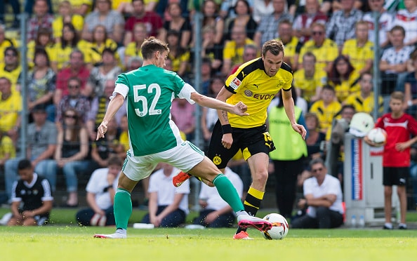 WUPPERTAL, GERMANY - AUGUST 01:  Fabian of Betis Sevilla challenges Kevin Grosskreutz of Borussia Dortmund  during the pre-season friendly match between Borussia Dortmund and Betis Sevilla at Stadium AM ZOO  on August 1, 2015 in Wuppertal, Germany.  (Photo by Alexandre Simoes/Borussia Dortmund/Getty Images)