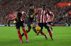 SOUTHAMPTON, ENGLAND - DECEMBER 02:  Emre Can of Liverpool gets between Ryan Bertrand and Victor Wanyama of Southampton during the Capital One Cup Quarter Final between Southampton and Liverpool at St Mary's Stadium on December 2, 2015 in Southampton, England.  (Photo by Catherine Ivill - AMA/Getty Images)