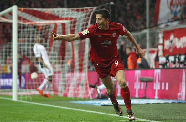 MUNICH, GERMANY - DECEMBER 12: Robert Lewandowski of Bayern Muenchen celebrates his first goal during the Bundesliga match between FC Bayern Muenchen and FC Ingolstadt at Allianz Arena on December 12, 2015 in Munich, Germany. (Photo by A. Beier/Getty Images for FC Bayern)
