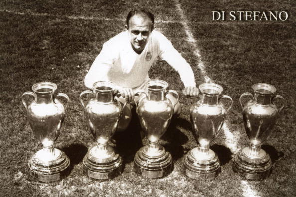 UNDATED: Alfredo Di Stefano of Real Madrid poses with European Cup trophies. (Photo by Real Madrid via Getty Images)