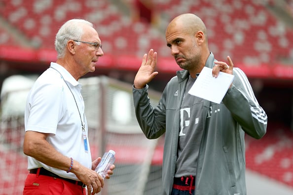 BEIJING, CHINA - JULY 17: FC Bayern Muenchen Honorary President Franz Beckenbauer (L) talks to head coach Josep Guardiola prior to a FC Bayern Muenchen training session at National Stadium at day 1 of the FC Bayern Audi China Summer Pre-Season Tour on July 17, 2015 in Beijing, China. (Photo by Alexander Hassenstein/Bongarts/Getty Images)